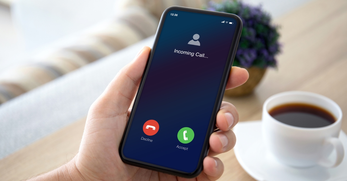 A cell phone screen reading “Incoming Call” at the top. Decline and Accept buttons are visible at the bottom.